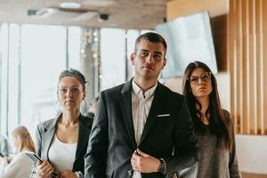 Group of successful business people standing together at office. photo