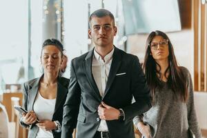 Group of successful business people standing together at office. photo