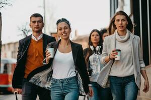 Elegant businesspeople walking in a modern city.. photo