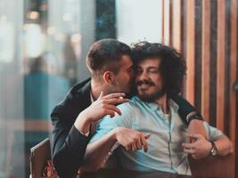 Portrait of multiethnic diverse gay LGBT romantic male couple embracing and showing their love photo