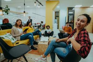 Multiethnic group of employees working in a marketing company. A group of colleagues is working on a project in modern offices photo