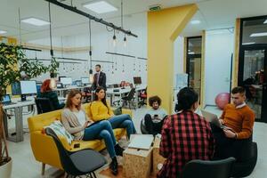 Multiethnic group of employees working in a marketing company. A group of colleagues is working on a project in modern offices photo