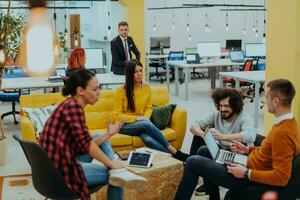 Multiethnic group of employees working in a marketing company. A group of colleagues is working on a project in modern offices photo