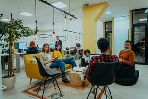 Multiethnic group of employees working in a marketing company. A group of colleagues is working on a project in modern offices photo