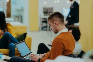 Multiethnic group of employees working in a marketing company. A group of colleagues is working on a project in modern offices photo