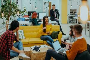 Multiethnic group of employees working in a marketing company. A group of colleagues is working on a project in modern offices photo