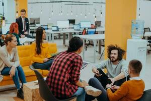 Multiethnic group of employees working in a marketing company. A group of colleagues is working on a project in modern offices photo