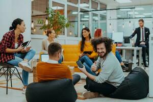 Multiethnic group of employees working in a marketing company. A group of colleagues is working on a project in modern offices photo
