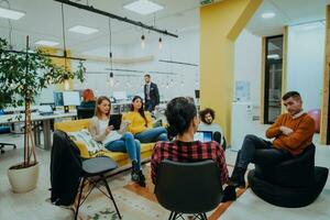 Multiethnic group of employees working in a marketing company. A group of colleagues is working on a project in modern offices photo