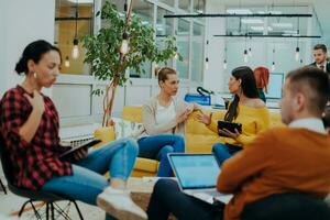 Multiethnic group of employees working in a marketing company. A group of colleagues is working on a project in modern offices photo