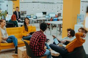 Multiethnic group of employees working in a marketing company. A group of colleagues is working on a project in modern offices photo