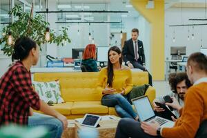 Multiethnic group of employees working in a marketing company. A group of colleagues is working on a project in modern offices photo
