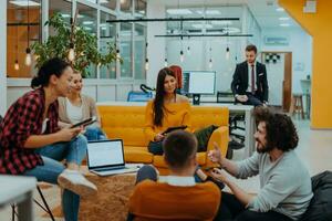 Multiethnic group of employees working in a marketing company. A group of colleagues is working on a project in modern offices photo