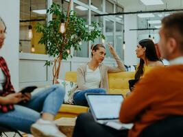 Multiethnic group of employees working in a marketing company. A group of colleagues is working on a project in modern offices photo