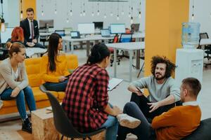 Multiethnic group of employees working in a marketing company. A group of colleagues is working on a project in modern offices photo