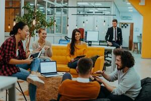 Multiethnic group of employees working in a marketing company. A group of colleagues is working on a project in modern offices photo