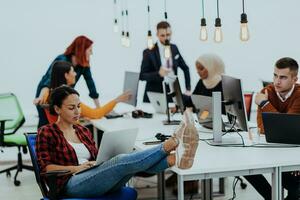 Multiethnic group of employees working in a marketing company. A group of colleagues is working on a project in modern offices photo