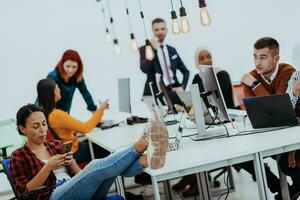 Multiethnic group of employees working in a marketing company. A group of colleagues is working on a project in modern offices photo