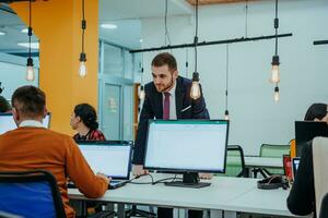 Multiethnic group of employees working in a marketing company. A group of colleagues is working on a project in modern offices photo