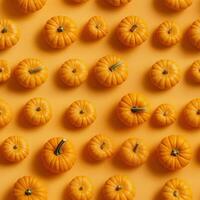 Pumpkins arranged on orange in top view. Suitable for Halloween and embracing the spirit of the fall season. Created with Generative AI technology photo
