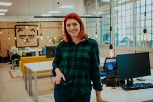 Female boss, manager executive posing in a modern startup office photo