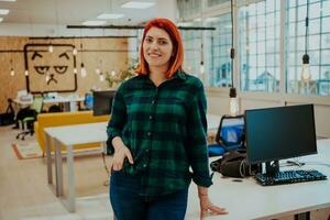 Female boss, manager executive posing in a modern startup office photo