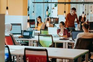 Multiethnic group of employees working in a marketing company. A group of colleagues is working on a project in modern offices photo