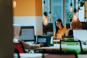 Multiethnic group of employees working in a marketing company. A group of colleagues is working on a project in modern offices photo