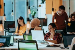Multiethnic group of employees working in a marketing company. A group of colleagues is working on a project in modern offices photo