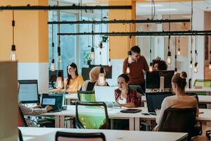 Multiethnic group of employees working in a marketing company. A group of colleagues is working on a project in modern offices photo