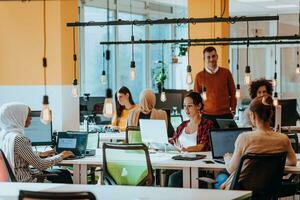 Multiethnic group of employees working in a marketing company. A group of colleagues is working on a project in modern offices photo