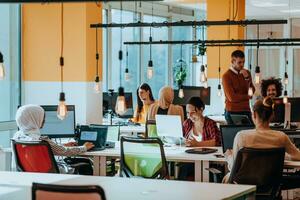 Multiethnic group of employees working in a marketing company. A group of colleagues is working on a project in modern offices photo