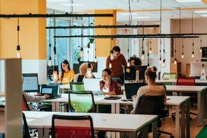 Multiethnic group of employees working in a marketing company. A group of colleagues is working on a project in modern offices photo