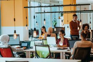 Multiethnic group of employees working in a marketing company. A group of colleagues is working on a project in modern offices photo