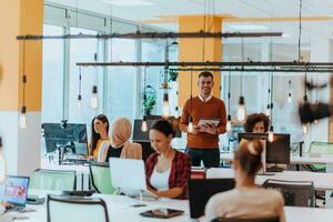 Multiethnic group of employees working in a marketing company. A group of colleagues is working on a project in modern offices photo