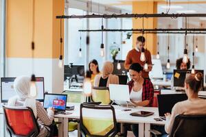 Multiethnic group of employees working in a marketing company. A group of colleagues is working on a project in modern offices photo