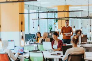 Multiethnic group of employees working in a marketing company. A group of colleagues is working on a project in modern offices photo
