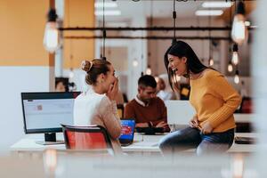 Multiethnic group of employees working in a marketing company. A group of colleagues is working on a project in modern offices photo