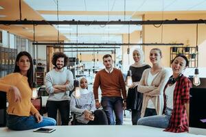 Multiethnic group of employees working in a marketing company. A group of colleagues is working on a project in modern offices photo