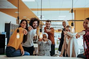 Multiethnic group of employees working in a marketing company. A group of colleagues is working on a project in modern offices photo