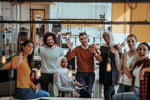 Multiethnic group of employees working in a marketing company. A group of colleagues is working on a project in modern offices photo