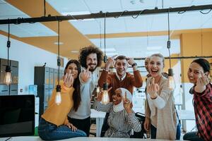 Group of diverse young man and girl in modern office showing middle finger photo