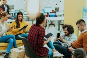 Multiethnic group of employees working in a marketing company. A group of colleagues is working on a project in modern offices photo
