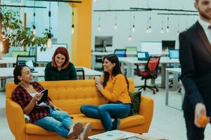 Multiethnic group of employees working in a marketing company. A group of colleagues is working on a project in modern offices photo