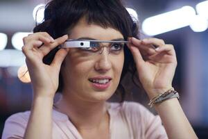 woman using virtual reality gadget computer glasses photo