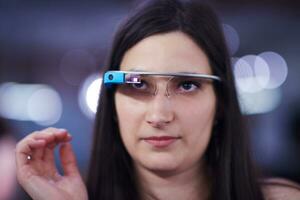 woman using virtual reality gadget computer glasses photo