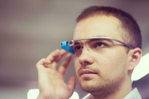 man using virtual reality gadget computer glasses photo