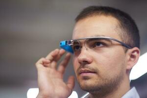 man using virtual reality gadget computer glasses photo