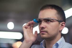 man using virtual reality gadget computer glasses photo