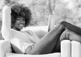 Beautifl black girl lying on couch photo